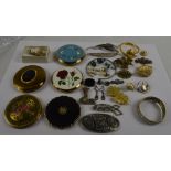 A quantity of costume jewellery including silver brooches, silver earrings, gold and pearl earrings,