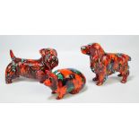 Three S Johnson Anita Harris marbled red ground figures of animals; two dogs and a pig,