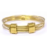 LINKS OF LONDON; an 18ct yellow gold bangle,