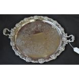 An electroplated twin handled circular tray with cast grapes and vines decorated rim,