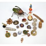 A group of collectors' items including badges, buttons, bracelet,