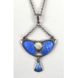 An early 20th century sterling silver and blue and white enamel pendant of winged form with a