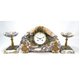 A French Art Deco three piece marble clock garniture with circular white enamel dial set with