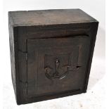 A 17th century oak spice cabinet, probably once part of a coffer,