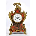 A late 19th century French Boulle work mantel clock with shaped case surmounted by a dragon above