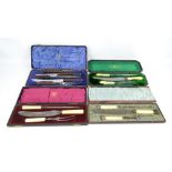 Four cased Sheffield steel carving sets including a three piece ivorine handled example by John