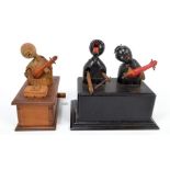 Two Japanese Meiji/early Showa period Kobe wooden articulated toys modelled as stylised musicians,