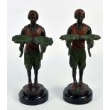 IN THE MANNER OF FRANZ BERGMANN; a modern reproduction pair of figures mounted on circular plinths,