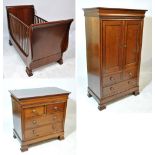 A Simon Horn 'Nursery Furniture' contemporary three piece cherry wood suite,