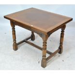 GOMME; a reproduction oak rectangular table on ring turned supports to block feet, length 98.5cm.