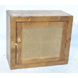 A pine single door meat safe with mesh grill and single shelf, width 55.5cm.