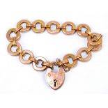 A 9ct rose gold flat cable link bracelet with heart shaped padlock clasp and safety chain,