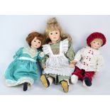 A group of bisque porcelain headed dolls with glass eyes and painted features,