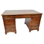 A Victorian walnut partners' desk with gilt tooled leather top above three short drawers,