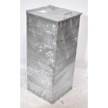 A galvanized metal lidded rectangular container with handle to the lid and liner for use as laundry