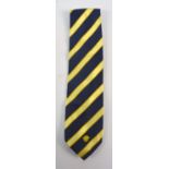 GIANNI VERSACE; a silk tie decorated with yellow and navy blue diagonal stripes.