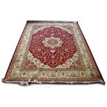 A red ground Keshan carpet, 230 x 160cm.