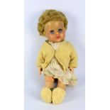 A mid-20th century Eegee type doll, the rubberized type head with blonde hair,