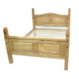 A modern pine 4' 6" double bed complete with base slats.