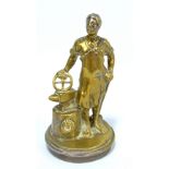 An unusual brass car mascot modelled as a blacksmith with an anvil,