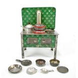 An early to mid-20th century tinplate toy stove with back plate, chimney and two door oven,