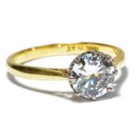 An 18ct yellow gold and platinum diamond solitaire ring, the old round brilliant cut stone approx 1.