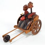 A Japanese Meiji/early Showa period Kobe wooden articulated toy modelled as stylised male and