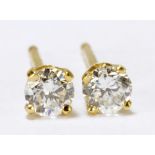 A pair of 14ct yellow gold diamond ear studs, the combined stones weighing approx 0.