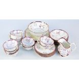 A 19th century lustre ware part tea service, comprising eleven cups (one af), twelve saucers,