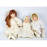 A group of dolls of bisque porcelain headed dolls with glass eyes, some with open mouths and teeth,