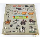 A blister pack of Britains models, figures on horseback and various farm animals.