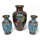 A pair of 19th century Chinese cloisonné enamel decorated vases of ovoid faceted forms,