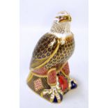 A large Royal Crown Derby paperweight modelled as an eagle, silver plug and printed marks to base,