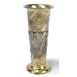 An Edward VII hallmarked silver vase of tapering form with part wrythen gadrooned decoration on