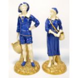 A pair of Royal Worcester porcelain powder blue glazed figures of 'French Fisher Girl' and 'French