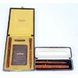 A cased De La Rue pen and pencil set,