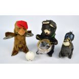 Three mid-20th century wind-up toys including a drum playing bear,