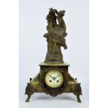 A French green onyx mantel clock surmounted by spelter figure entitled 'A la Fontaine' after F.