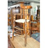 A 19th century stained beech rush seated high chair.