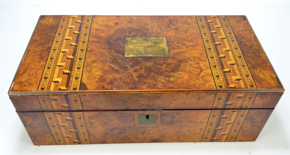 A Victorian burr walnut and parquetry inlaid writing slope with inscribed brass rectangular