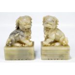 A pair of Chinese carved soapstone figures of Dogs of Fo, height 12.5cm (2).