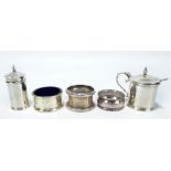 ROBERT PRINGLE & SONS; a George V hallmarked silver three piece cruet set of plain circular form,