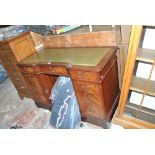 A reproduction mahogany twin pedestal desk with inset leatherette top above an arrangement of nine