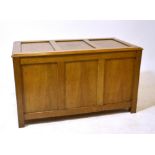 A mid-20th century oak three-panel blanket chest on square supports, width 100cm.