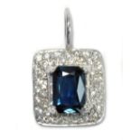 A natural sapphire and diamond pendant, the raised rectangular sapphire weighing 1ct,