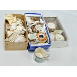 A child's toy dinner service decorated with foliate border comprising plates and platters,