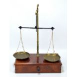 A W&T Avery of Birmingham set of brass bean scales on mahogany base with single drawer and various