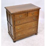 An oak chest of two short and three long drawers on bun feet, width 76cm.