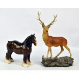 A Beswick matt glazed model deer on a rocky outcrop, height 35cm,