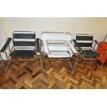 A pair of tubular chrome and black leather armchairs inspired by 'Wassily Chair' after the design